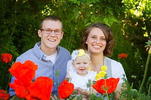 small family portrait with poppie fields Small family in poppy fields