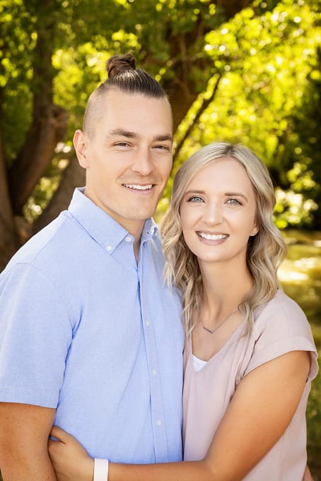 1610-AndersenCherie-FAM-20250816 web 2560 A young couple smiling together for a close-up outdoor portrait by Masterpiece Images in Ogden, Utah.